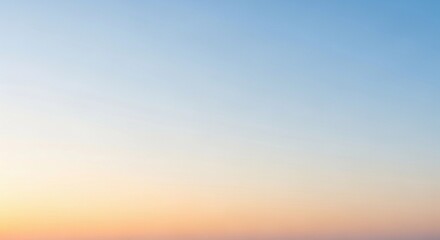 Obraz premium A minimalist dawn sky with a smooth gradient from soft peach near the horizon to pale blue above. No harsh contrasts, only gentle color transitions and diffused light. The atmosphere is calm and open,