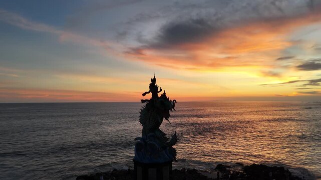 Aerial view of Statue Gajah Mina at sunset, Pererenan Beach, Bali, Indonesia