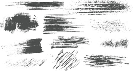 Collection of dark grey grunge brush strokes and splatters on white background texture