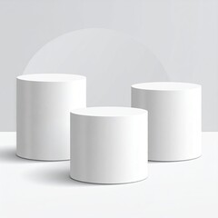 3 white cylinder podiums against a simple background