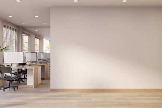 White wall corridor aside office working room with computer table and chair on wooden parquet floor.