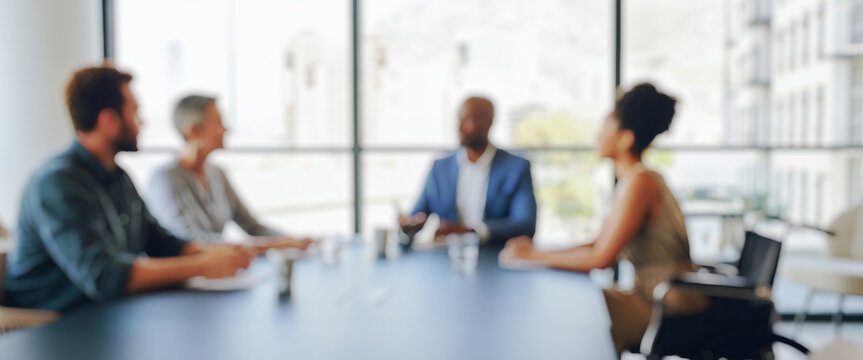 Blurred business meeting with diverse people around a conference table, highlighting collaboration, inclusivity, and teamwork in a modern workspace full of energy and shared ideas.