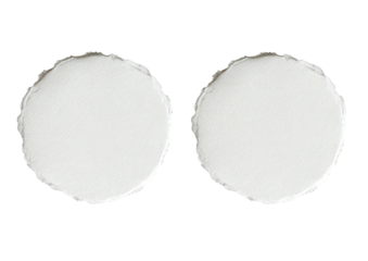 Two textured white circles, close-up, isolated on black