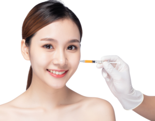 A woman receives a cosmetic injection, smiling confidently, showcasing beauty and skincare in a clinical setting.
