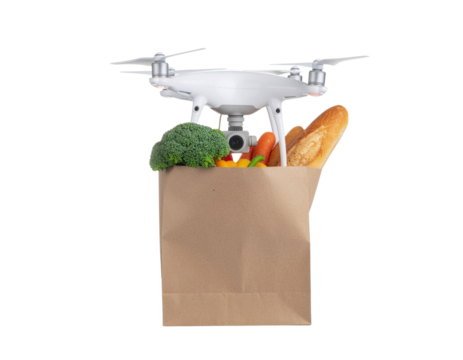 A drone carries a paper bag filled with fresh vegetables and bread.