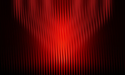Red theater curtains with spotlight effect stage