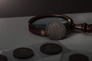 Numismatics. Old collectible coins on the table.