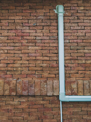 Ventilation system. Air conditioner duct cover or Slim Duct or Duct liner installed on brick wall to protect refrigerant lines and keep installation neat and tidy. Air conditioning refrigerant pipe.