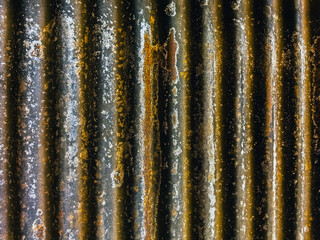 Artistic of old and rusty zinc sheet wall. Vintage style metal sheet roof texture. Pattern of old metal sheet. Rusting metal or siding. Corrosion of galvanized. Background and texture in retro concept