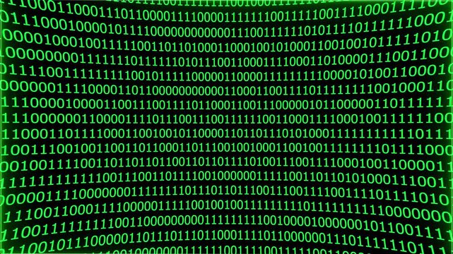 A close-up of a screen displaying binary code in green color. Computer language in motion of coding big data. Perfect for futuristic animations.
