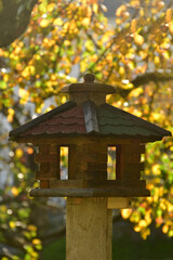 bird feeder house in a German garden in autumn