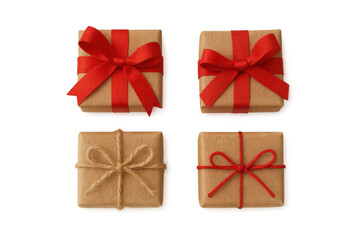 Group of four presents wrapped in brown kraft paper with various red ribbons and natural twine bows, ready for celebration