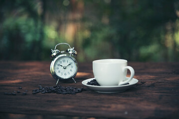 Close up hands of man sitting office desk holding sweet coffee cup relax and enjoy with happy time. Hot coffee mug in hand. Man holding coffee cup relaxing after work at office warm taste in cafe