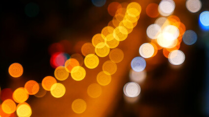 Bokeh abstract blurred background festive traffic yellow orange green red lights on road with sparkling circular animate motion 3D. Backdrop with twinkling bright shape blinking lights in modern city