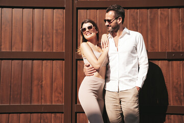 Beautiful fashion woman and her handsome elegant boyfriend in white shirt. Sexy smiling model in...