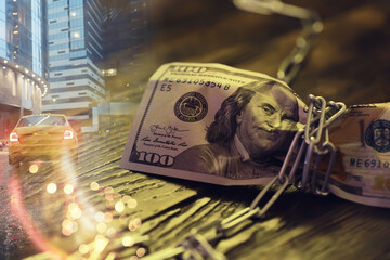 The American currency is dollars, tied with a chain. double exposure business city