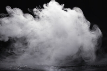 Fototapeta premium White clouds of vapor smoke are isolated on a black background. overlay