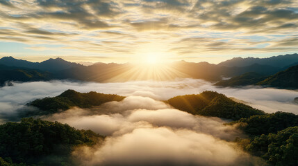 Golden sunrise breaking through morning mist over tranquil mountains, creating serene atmosphere