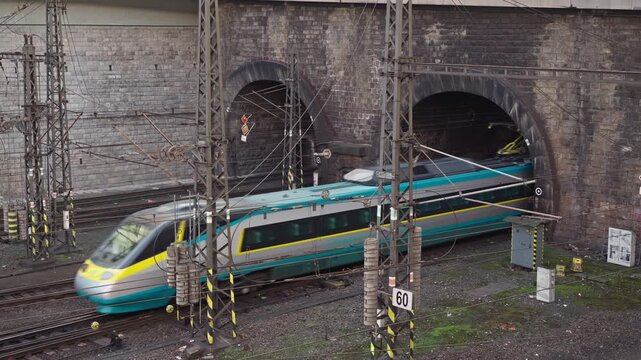 Inter-city electric passenger train enters Pendelino rail tunnel Prague