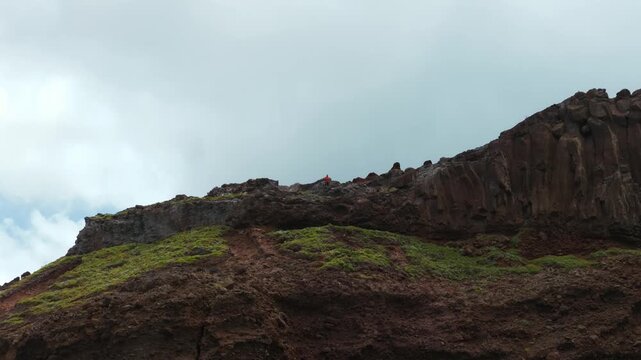 Aerial drone view of rugged volcanic rock formations at Calhau da Furna do Bode, Madeira, Portugal