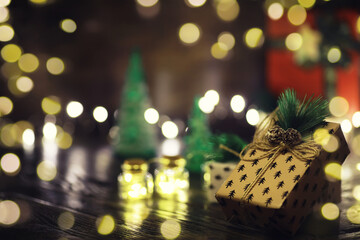 Gift boxes against a background bokeh of twinkling party lights. Luxury New Year gift. Christmas...