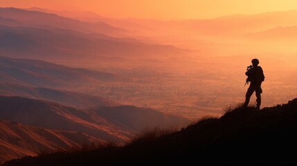 A lone soldier stands silhouette against a vibrant sunset sky, overlooking a serene mountain landscape.