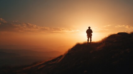 Fototapeta premium Silhouette of a soldier against a stunning sunset, capturing a moment of reflection and resilience in nature's beauty.