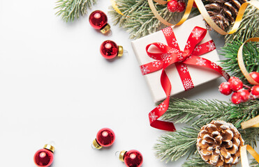 Christmas giftbox with pine branches and ornaments