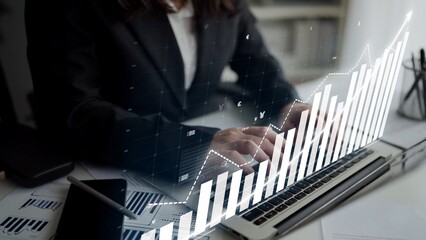 A business professional is engaged in financial data analysis on a laptop, showcasing digital graphs and charts that illustrate market trends and performance insights. Copula