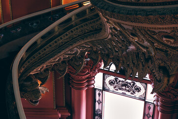 Curved staircase with elaborate carvings inside Erawan Museum, Bangkok. Intricate Thai design...