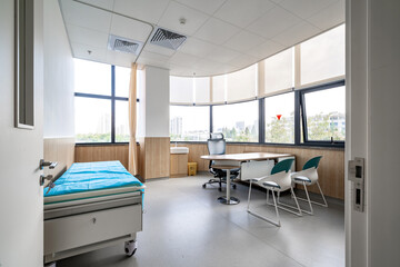 hospital examination room with a bed, desk