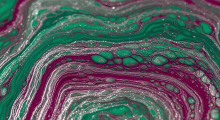 Abstract fluid art with green magenta and silver creating a mesmerizing pattern