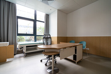 hospital examination room with a bed, desk