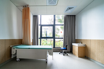 hospital examination room with a bed, desk
