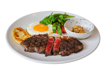 Delicious steak served with fried egg and other ingredients, a culinary delight ready to be savored. The dish has a visually appealing presentation on a plate