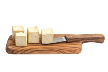 A block of tofu on a wooden cutting board isolated on transparent background. Tofu on chopping board isolated on white background.