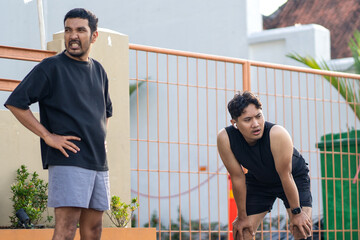 Asian Indonesian Men Resting After Outdoor Running Exercise