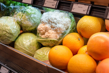 Supermarket vegetables. Fresh vegetables and fruits on supermarket shelves.