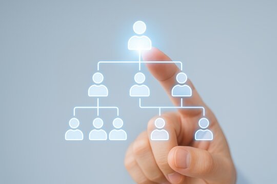 Hand Touching a Digital Organizational Chart Displaying Hierarchy and Leadership Structure in a Modern Workplace