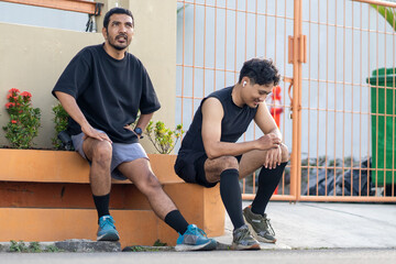 Asian Indonesian Men Resting After Outdoor Running Exercise