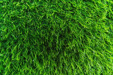 Artificial green grass mat background, plastic grass texture