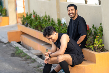Asian Indonesian Men Resting After Outdoor Running Exercise