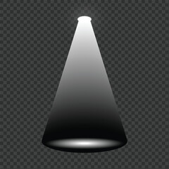 Bright spotlight beam illuminating the dark stage floor with subtle shadows