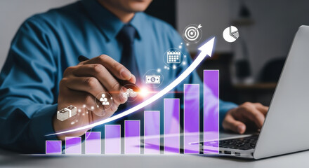Businessman Working with Virtual Growing Business Chart and Technology Icons on Laptop