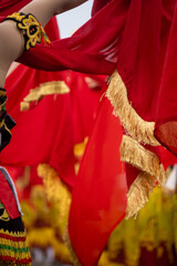 Vibrant Selandang Merah or red scarf in action, part of a colossal traditional dance in East Java, Indonesia called Gandrung Sewu. 