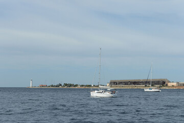 Yachts at the Chersonesos lighthouse in Sevastopol, Crimea
