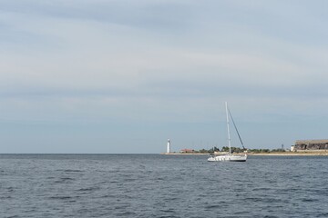 Yacht "Saturday " at the Chersonesos lighthouse in Sevastopol, Crimea