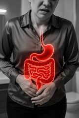 Person Experiencing Digestive Discomfort with Overlay of Human Digestive System in Red Glow