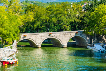 Fototapeta premium Old stone bridge over canal in town of Crikvenica, Croatia 