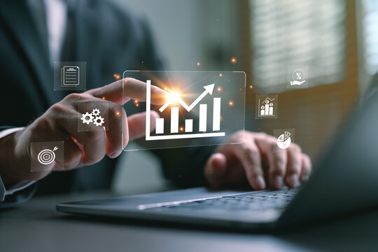 Businessman analyzing profit and quality management with financial forecasting, budgeting, and long-term planning for product quality, company revenue, and expense projections.